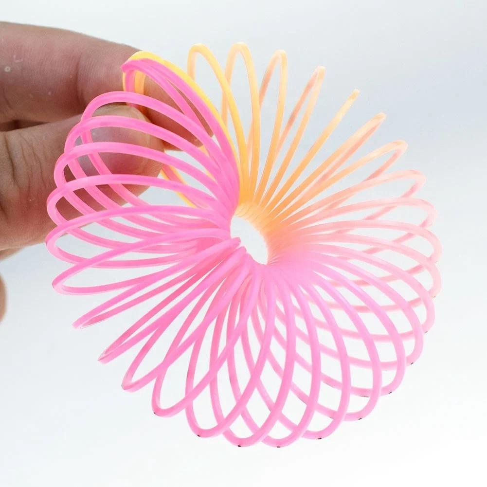 12Pcs Rainbow Smile Magic Springs Circle Toys for Children Birthday Party Favors Giveaway Gifts Cartflix.pk